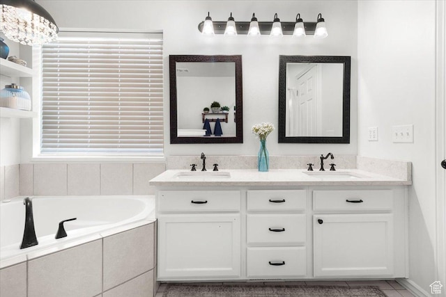 full bath featuring a bath, double vanity, and a sink