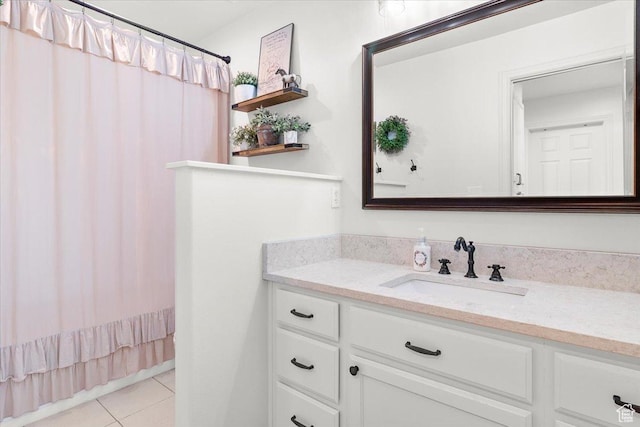bathroom featuring a shower with curtain, tile patterned flooring, and vanity
