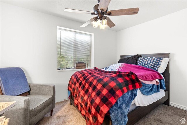 carpeted bedroom with a ceiling fan