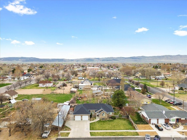 drone / aerial view featuring a residential view and a mountain view