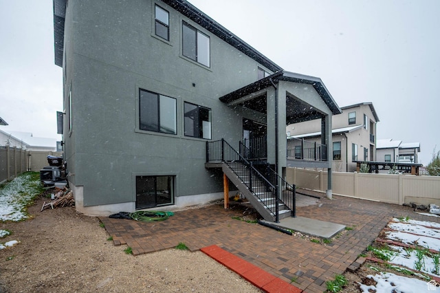 14913 S Thorntree Ln, Herriman, UT 84096 - back of property with a fenced backyard, a patio area, stairway, and stucco siding