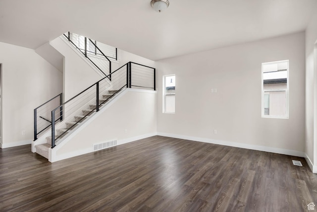 14913 S Thorntree Ln, Herriman, UT 84096 - unfurnished living room featuring stairs, wood finished floors, and baseboards