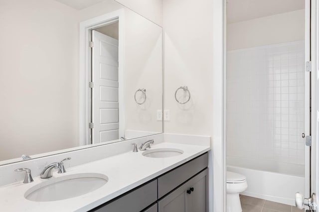 14913 S Thorntree Ln, Herriman, UT 84096 - bathroom featuring toilet, tile patterned floors, double vanity, and shower / bathtub combination