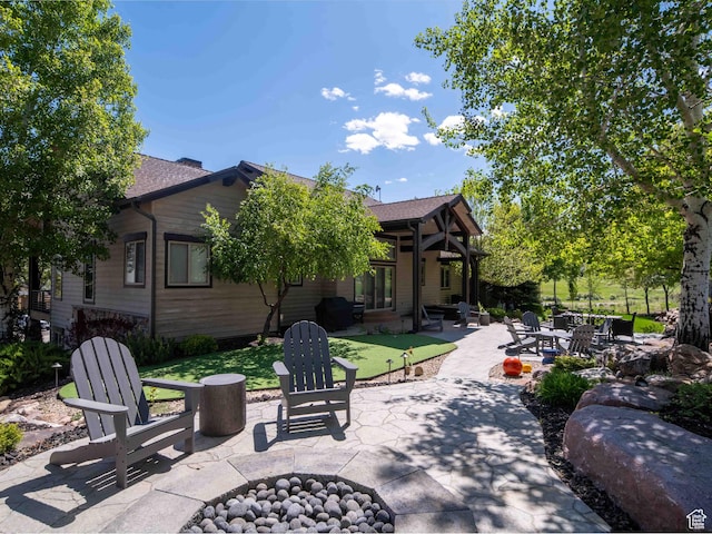 1049 S Meadow Lark Ln E, Huntsville, UT 84317 - view of patio / terrace featuring a fire pit