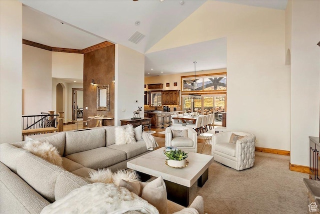 1049 S Meadow Lark Ln E, Huntsville, UT 84317 - carpeted living room featuring high vaulted ceiling, arched walkways, and baseboards