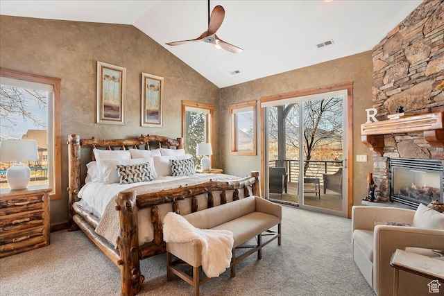 1049 S Meadow Lark Ln E, Huntsville, UT 84317 - bedroom with light carpet, access to exterior, vaulted ceiling, multiple windows, and a fireplace