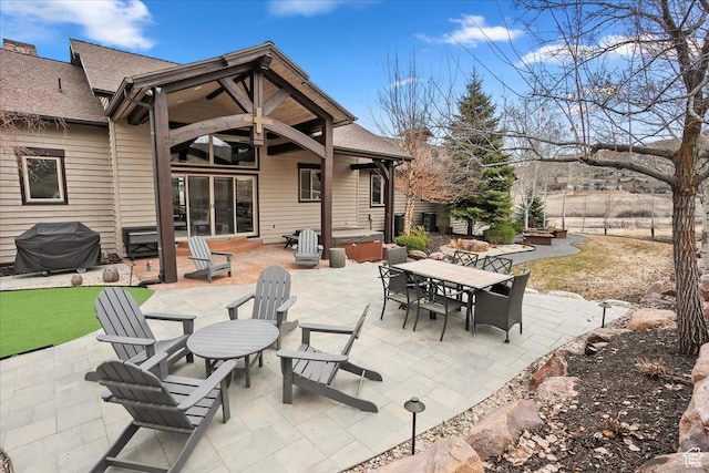 1049 S Meadow Lark Ln E, Huntsville, UT 84317 - view of patio / terrace featuring a hot tub, outdoor dining area, and area for grilling