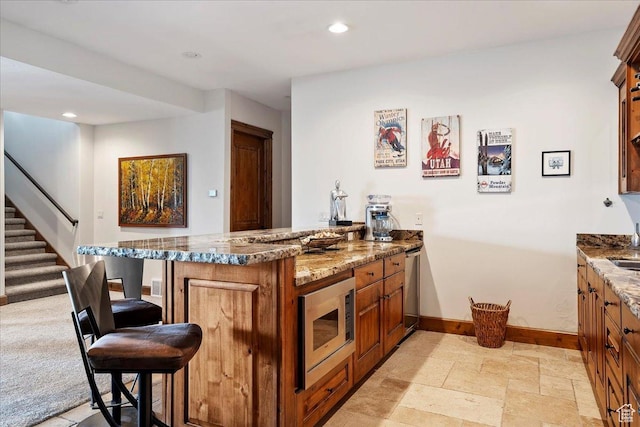 1049 S Meadow Lark Ln E, Huntsville, UT 84317 - indoor bar with stainless steel microwave, baseboards, stairway, recessed lighting, and light stone finish floors