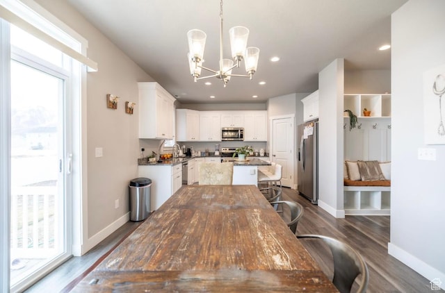 910 N 260 W, Santaquin, UT 84655 - dining room with dark wood-type flooring, baseboards, a chandelier, and recessed lighting