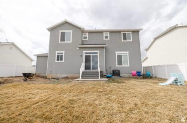 910 N 260 W, Santaquin, UT 84655 - back of property with central air condition unit, entry steps, fence, and a yard