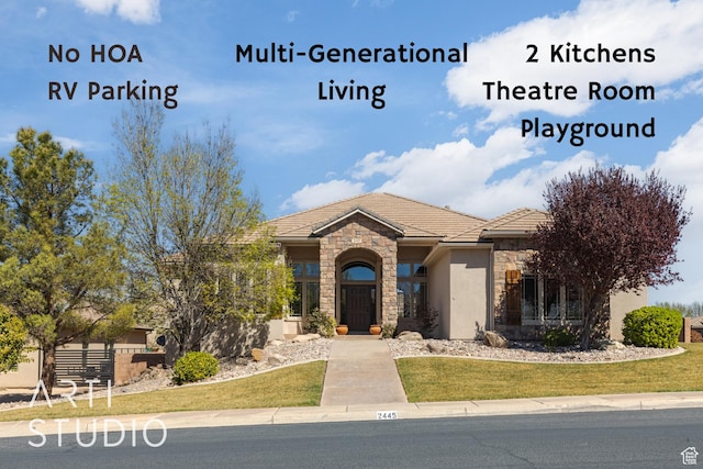 2445 E 2860 S, St George, UT 84790 - exterior space with stone siding, a tile roof, stucco siding, and a front lawn