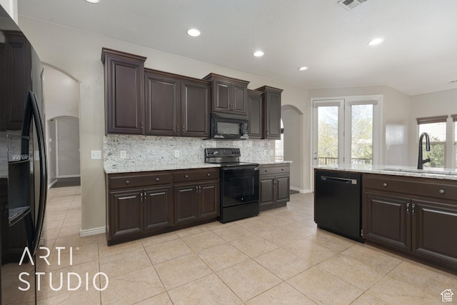 2445 E 2860 S, St George, UT 84790 - kitchen featuring backsplash, a sink, arched walkways, dark brown cabinets, and black appliances