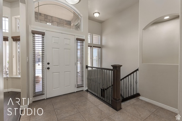 2445 E 2860 S, St George, UT 84790 - entryway with tile patterned floors, baseboards, and a healthy amount of sunlight
