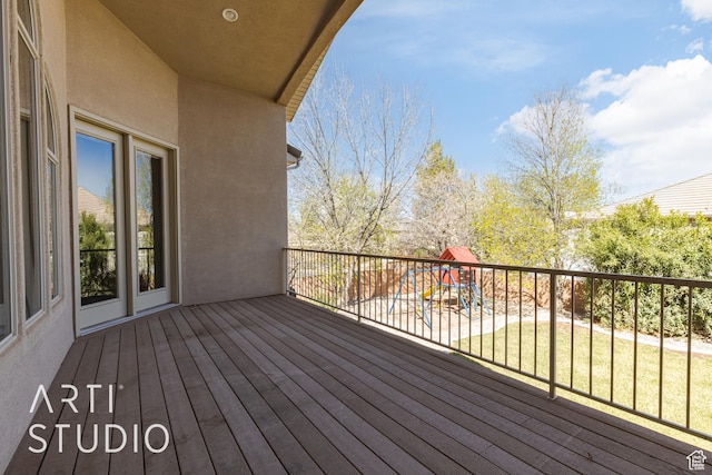 2445 E 2860 S, St George, UT 84790 - wooden terrace featuring a playground and a lawn