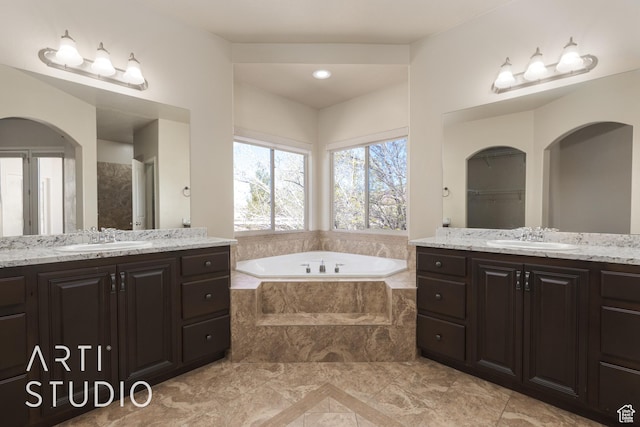 2445 E 2860 S, St George, UT 84790 - bathroom featuring a garden tub, a sink, and two vanities