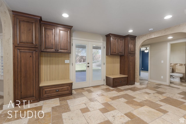 2445 E 2860 S, St George, UT 84790 - kitchen with arched walkways, french doors, recessed lighting, and stone tile floors