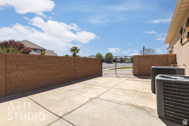 2445 E 2860 S, St George, UT 84790 - view of patio featuring a gate, fence, and central AC