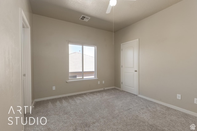 2445 E 2860 S, St George, UT 84790 - unfurnished bedroom featuring a textured ceiling, visible vents, baseboards, a ceiling fan, and carpet floors