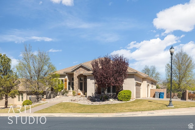 2445 E 2860 S, St George, UT 84790 - view of front facade featuring stucco siding, an attached garage, a front yard, and driveway