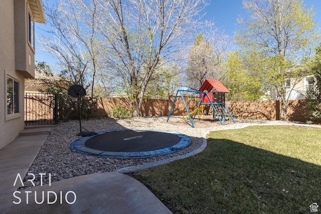2445 E 2860 S, St George, UT 84790 - view of yard featuring a fenced backyard, a playground, and a trampoline