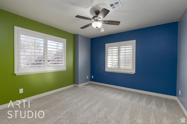 2445 E 2860 S, St George, UT 84790 - carpeted empty room with a healthy amount of sunlight, visible vents, baseboards, and a ceiling fan
