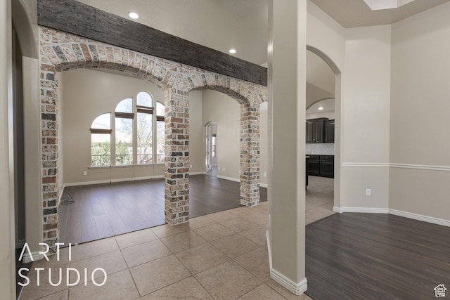 2445 E 2860 S, St George, UT 84790 - foyer with baseboards, arched walkways, tile patterned flooring, and ornate columns