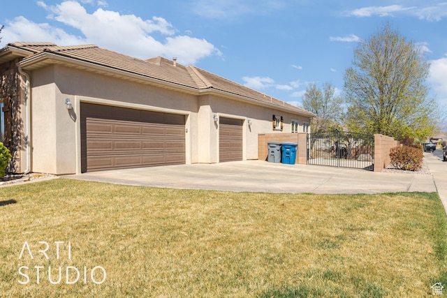 2445 E 2860 S, St George, UT 84790 - view of side of home featuring a tiled roof, stucco siding, driveway, and a garage