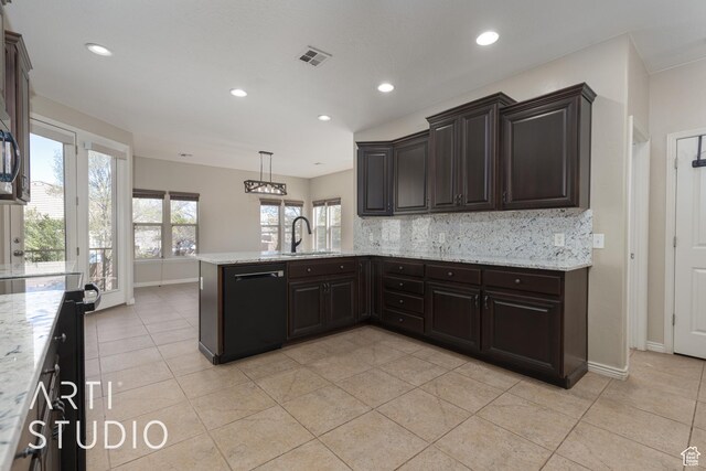 2445 E 2860 S, St George, UT 84790 - kitchen with a sink, a peninsula, black dishwasher, visible vents, and decorative backsplash