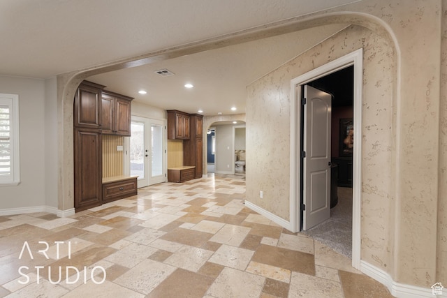 2445 E 2860 S, St George, UT 84790 - interior space with baseboards, wallpapered walls, recessed lighting, stone tile flooring, and arched walkways