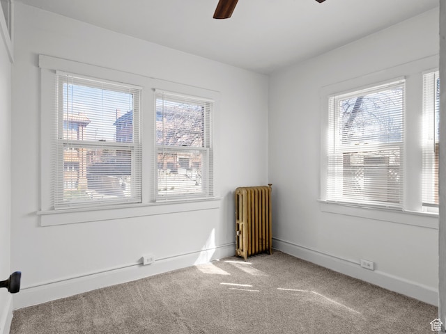 146 E 2nd Ave, Salt Lake City, UT 84103 - carpeted empty room featuring radiator heating unit, baseboards, and ceiling fan