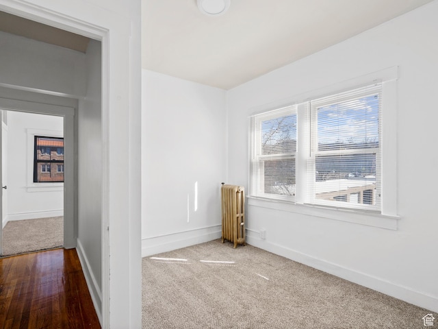 146 E 2nd Ave, Salt Lake City, UT 84103 - carpeted empty room with baseboards and radiator heating unit