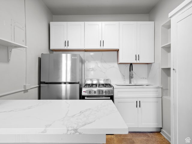 146 E 2nd Ave, Salt Lake City, UT 84103 - kitchen with white cabinets, a sink, stainless steel appliances, and open shelves