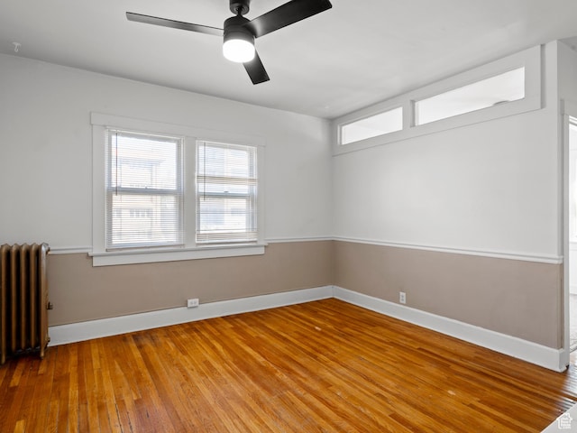 146 E 2nd Ave, Salt Lake City, UT 84103 - spare room with radiator, light wood-style floors, ceiling fan, and baseboards