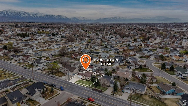 drone / aerial view with a mountain view and a residential view