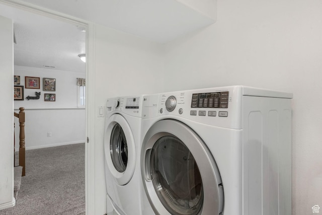 laundry room featuring baseboards, carpet flooring, ornamental molding, and independent washer and dryer