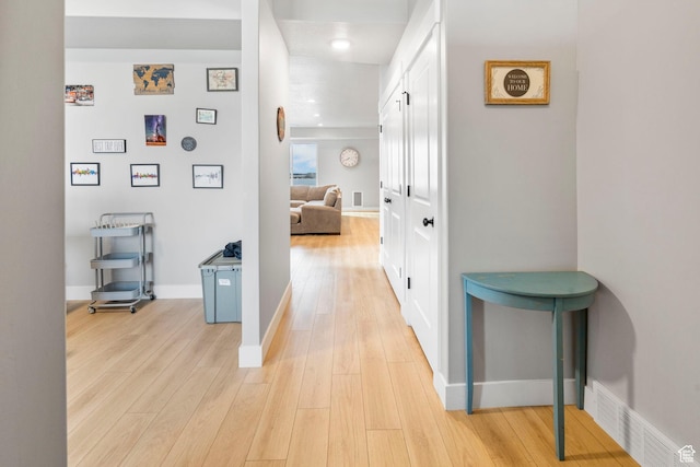 3161 N 3150 W, Plain City, UT 84404 - hallway with baseboards, visible vents, and light wood-style flooring