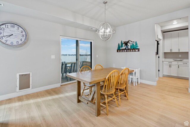 3161 N 3150 W, Plain City, UT 84404 - dining area featuring an inviting chandelier, baseboards, light wood finished floors, and visible vents