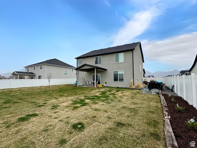 3161 N 3150 W, Plain City, UT 84404 - rear view of property featuring a fenced backyard, a lawn, and stucco siding