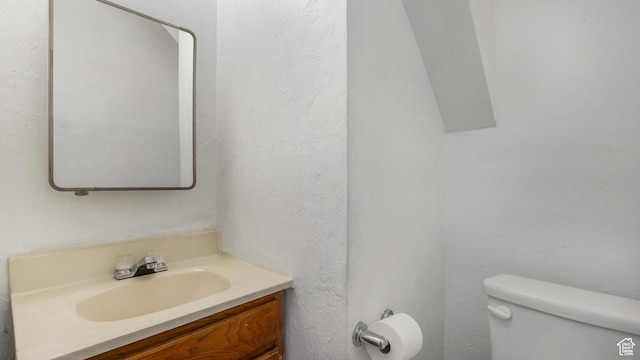 1423 Arthur Dr, Provo, UT 84601 - half bathroom with toilet, vanity, and a textured wall
