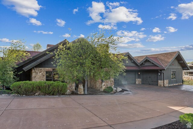 7507 Sage Meadow Rd, Park City, UT 84098 - view of front of property featuring stone siding, driveway, board and batten siding, and an attached garage