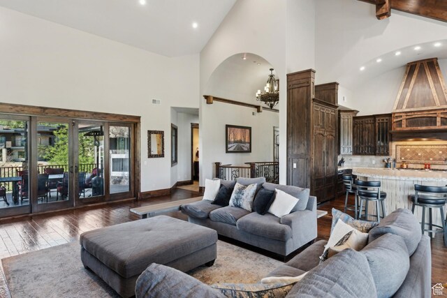 7507 Sage Meadow Rd, Park City, UT 84098 - living area with high vaulted ceiling, a chandelier, dark wood finished floors, french doors, and baseboards