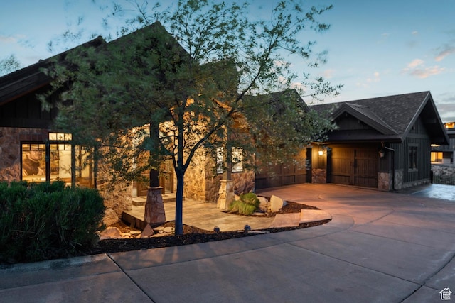 7507 Sage Meadow Rd, Park City, UT 84098 - view of front of property featuring stone siding, board and batten siding, driveway, and a garage