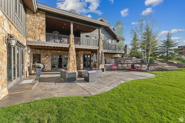 7507 Sage Meadow Rd, Park City, UT 84098 - back of house with a balcony, stone siding, a yard, and a patio area