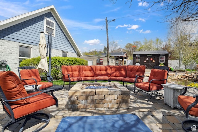 368 E 300 N, Logan, UT 84321 - view of patio featuring an outdoor living space with a fire pit, a shed, and an outbuilding