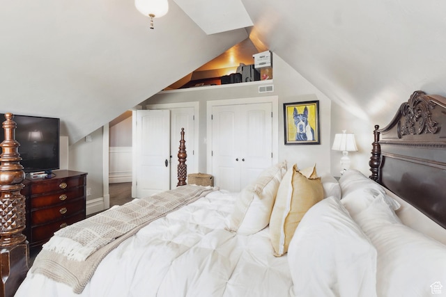 368 E 300 N, Logan, UT 84321 - bedroom featuring visible vents, lofted ceiling, and two closets