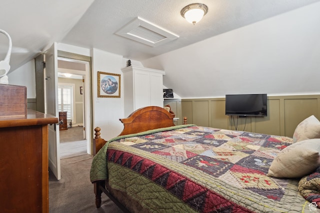 368 E 300 N, Logan, UT 84321 - bedroom with carpet floors, a decorative wall, and vaulted ceiling