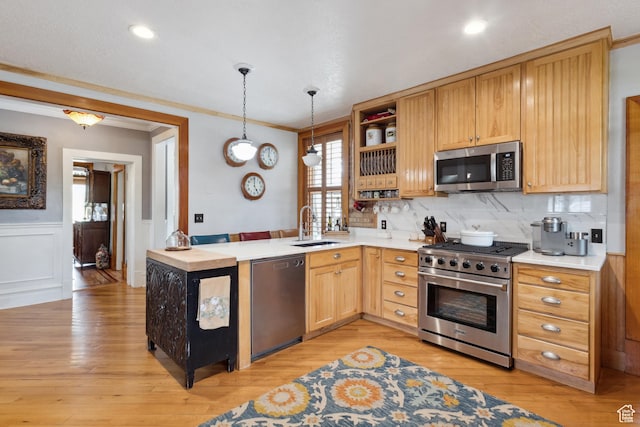 368 E 300 N, Logan, UT 84321 - kitchen featuring a sink, open shelves, light countertops, ornamental molding, and appliances with stainless steel finishes
