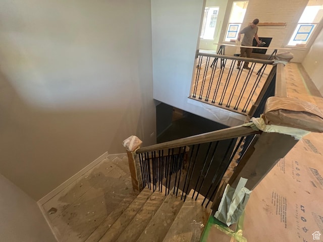 551 W Summerhill Ln, Centerville, UT 84014 - staircase featuring a healthy amount of sunlight and baseboards