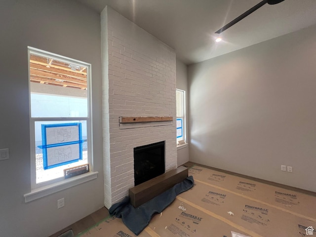 551 W Summerhill Ln, Centerville, UT 84014 - unfurnished living room featuring a fireplace
