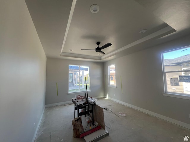 551 W Summerhill Ln, Centerville, UT 84014 - empty room with baseboards, a ceiling fan, and a tray ceiling